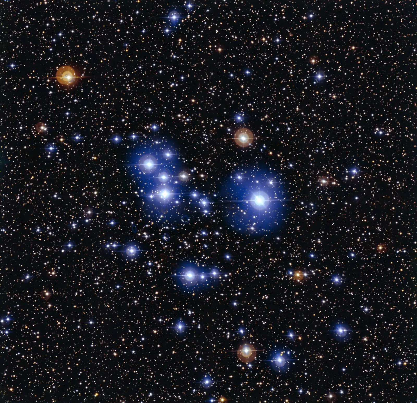 The open star cluster Messier 47: a loose scattering of bright blue-white stars against a darker field — a cluster of siblings born from one cloud.