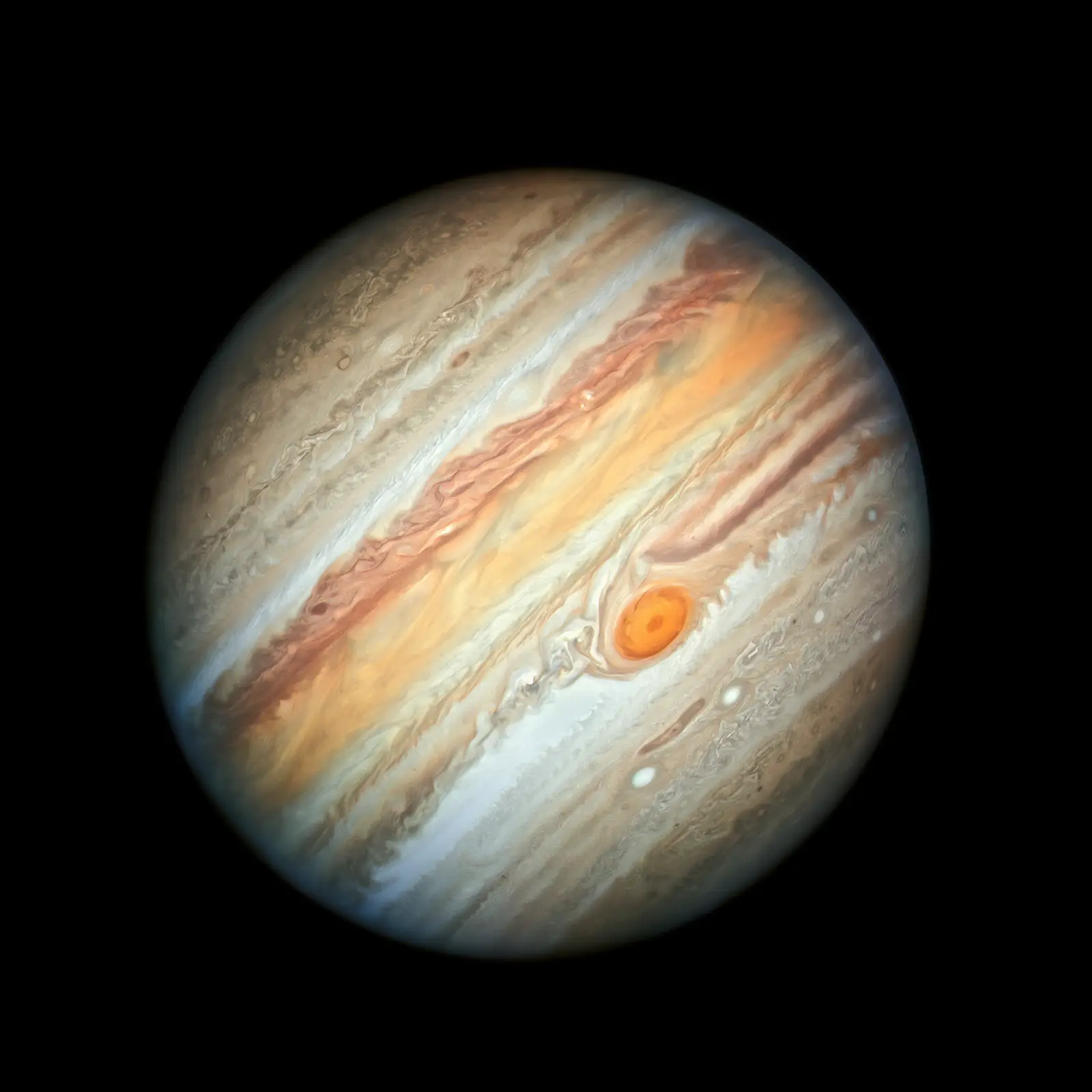 Jupiter filling the frame in banded cream, ochre and rust, with the Great Red Spot prominent below the equator.