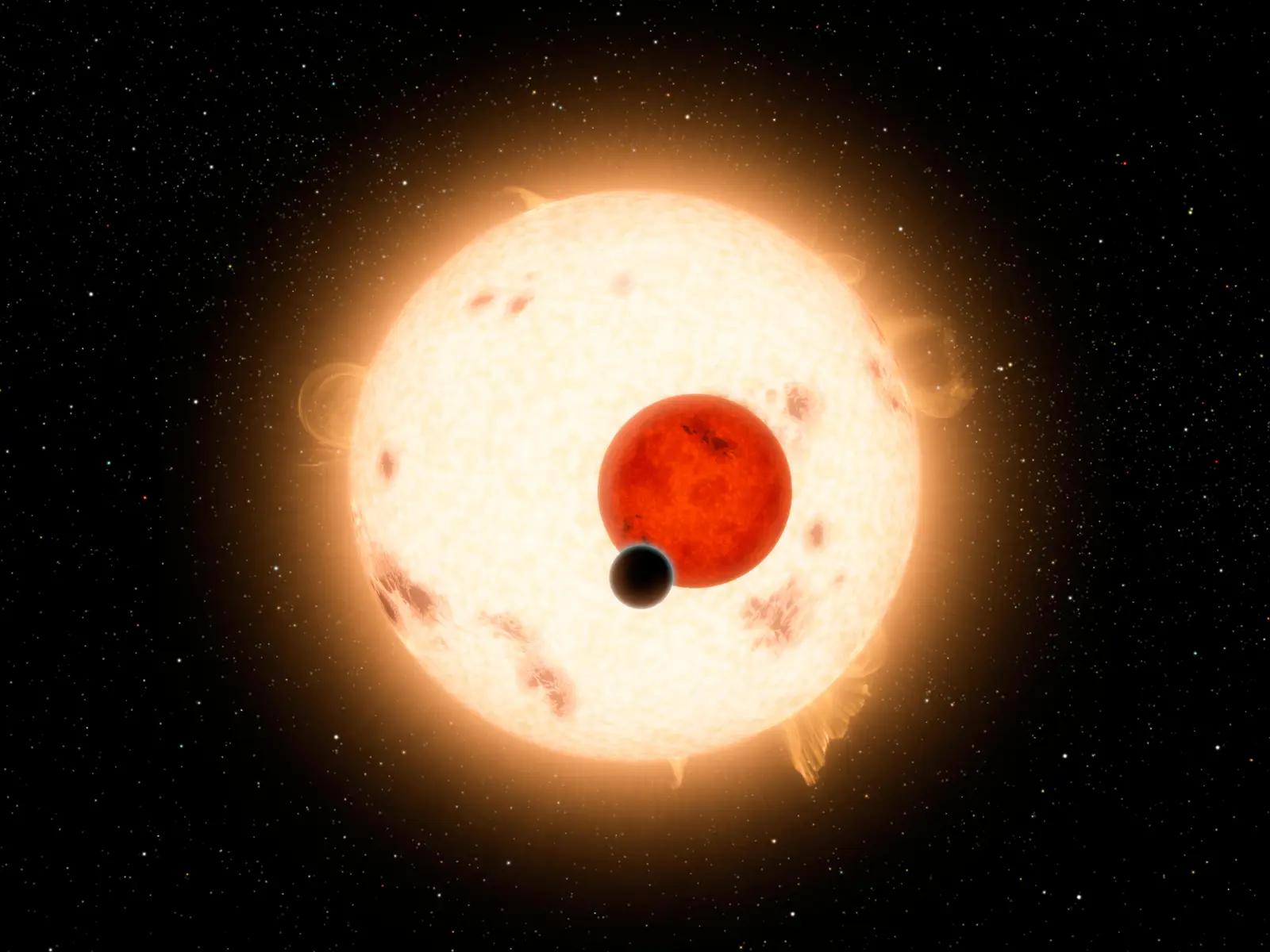 An artist’s concept of the surface of Kepler-16b with two suns — one large and orange, one smaller and red — setting together on the horizon.