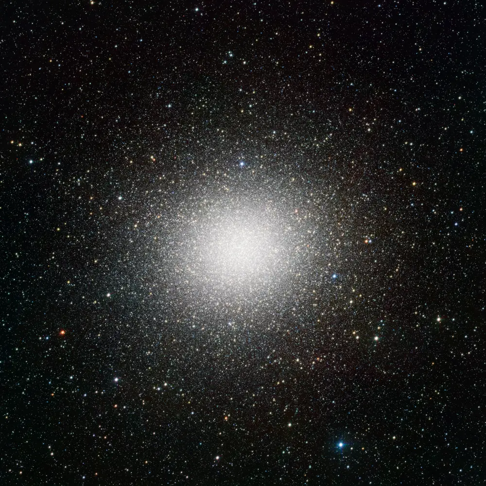The giant globular cluster Omega Centauri imaged by the VLT Survey Telescope: millions of stars packed into a single glowing sphere that fills the frame.