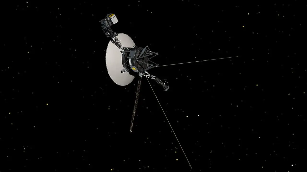 An artist’s rendering of the Voyager spacecraft — its dish antenna and long booms — against a backdrop of stars.
